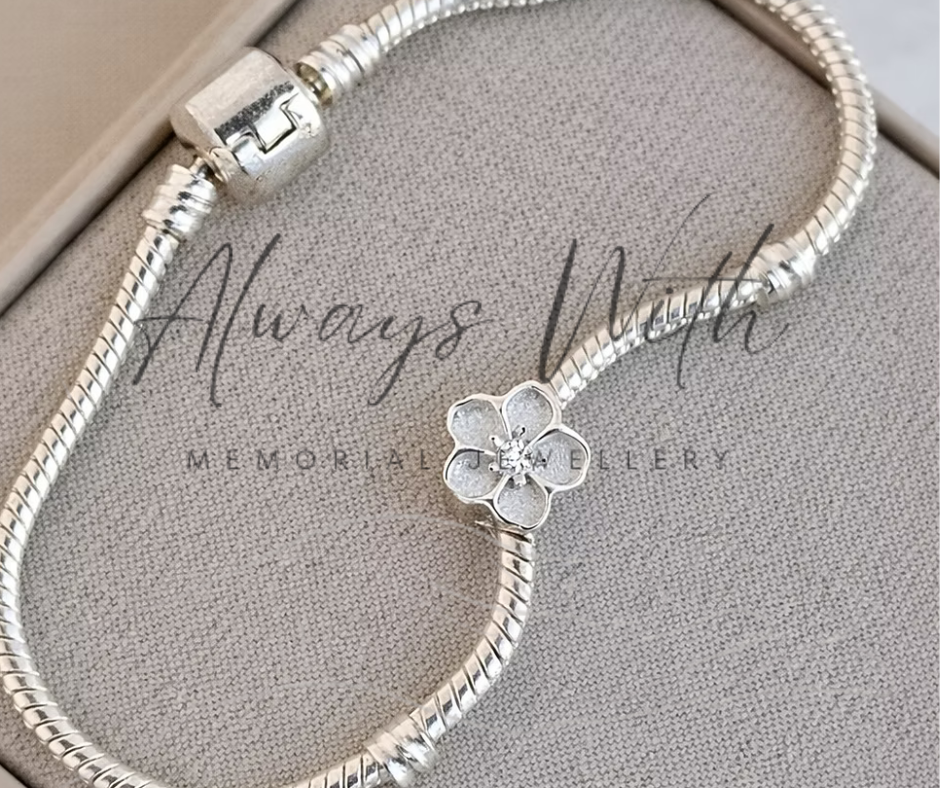 The "Forget Me Not" Charm